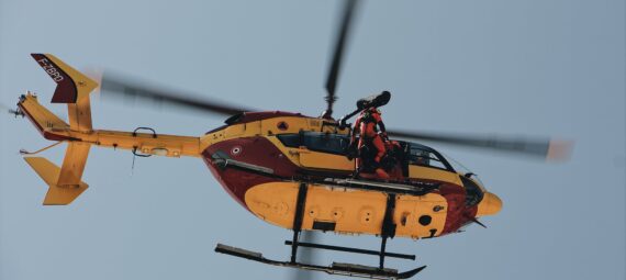 low angle photo of person on helicopter