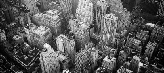 aerial view and grayscale photography of high rise buildings