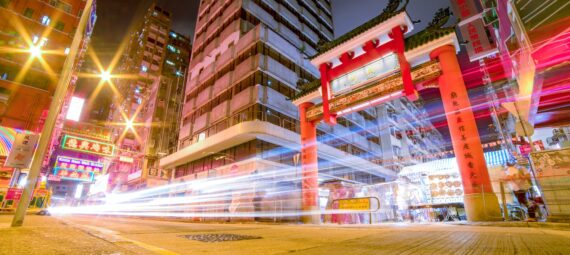 time lapse photography of vehicles passing through china town