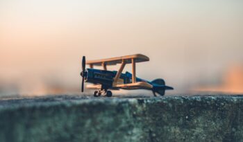 black and brown wooden plane scale model