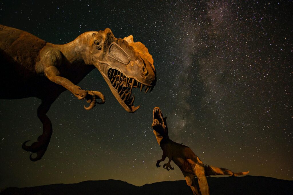 dinasors with a night sky as a background